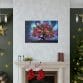 A living room with a Christmas tree and stockings on the mantle, featuring the Luminating Tree Canvas artwork.