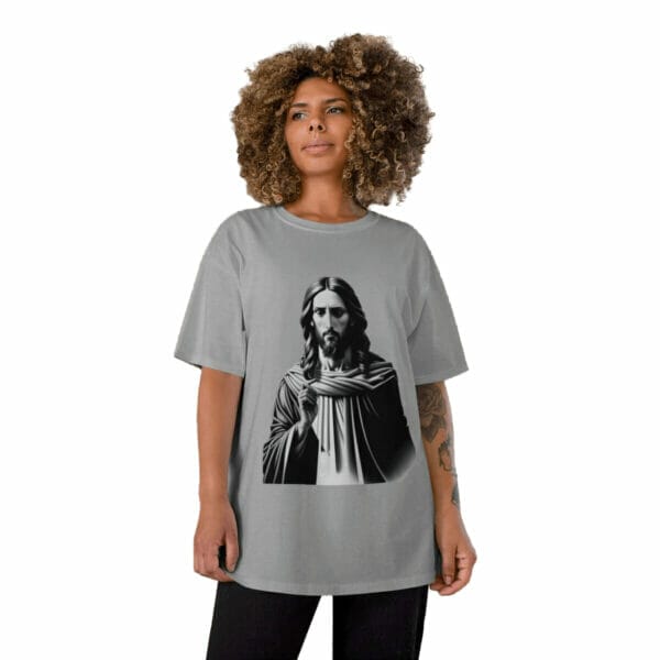 A woman wearing a grey t - shirt with a black and white image of jesus. A woman wearing a grey t - shirt with a black and white image of jesus.