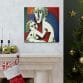 The "Mother's Love Cubism Art Canvas," inspired by Picasso's cubist style, features two abstract figures and is prominently displayed above a fireplace decorated for the holidays with festive ornaments and a nearby Christmas tree.