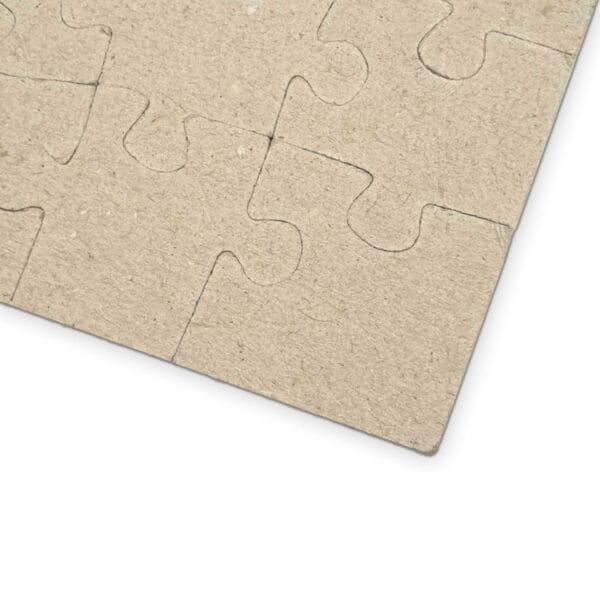 Close-up of a corner section of the Santa's Flying Reindeer Puzzle, showcasing interlocking pieces in a beige color. Close-up of a corner section of the Santa's Flying Reindeer Puzzle, showcasing interlocking pieces in a beige color.