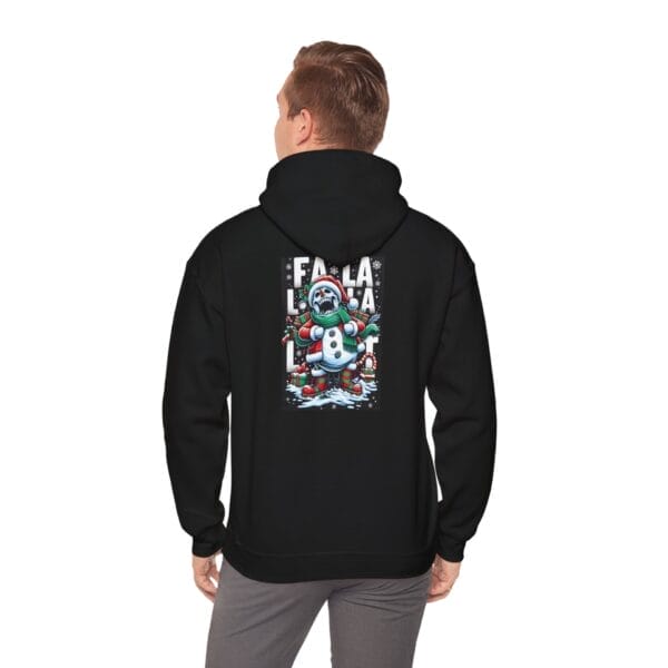 A man is wearing the "Happy Evil Snowman" Unisex Heavy Blend™ Hooded Sweatshirt, which features a colorful cartoon character and holiday-themed text on the back. A man is wearing the "Happy Evil Snowman" Unisex Heavy Blend™ Hooded Sweatshirt, which features a colorful cartoon character and holiday-themed text on the back.