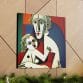 The "Mother's Love Cubism Art Canvas," featuring a person holding a child in geometric shapes and bold colors, enhances a wooden wall adorned with a garland below.