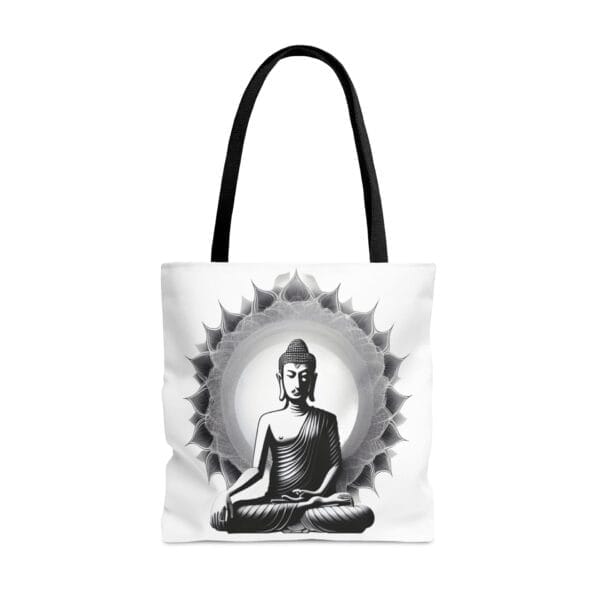 The Buddha Tote Bag (AOP), from our exclusive collection, features a striking black and white illustration of a seated Buddha with an intricate decorative circular pattern behind.