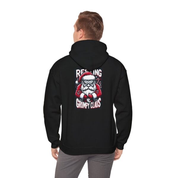 Individual wearing a black "Grumpy Santa Claus" design Heavy Blend™ Unisex Hooded Sweatshirt. Individual wearing a black "Grumpy Santa Claus" design Heavy Blend™ Unisex Hooded Sweatshirt.