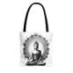 The Buddha Tote Bag (AOP) features a sophisticated black and white depiction of Buddha in meditation, accented by an intricate circular pattern. The black handles enhance its timeless appeal, making it an ideal accessory for those who value mindful design.