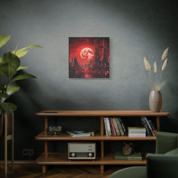 The "Blood Moon Over Ruins — Dystopian Cityscape Canvas, Stretched, 1.25"" hangs above a wooden shelf holding books, a vintage radio, a vase with pampas grass, and a potted plant. The "Blood Moon Over Ruins — Dystopian Cityscape Canvas, Stretched, 1.25"" hangs above a wooden shelf holding books, a vintage radio, a vase with pampas grass, and a potted plant.
