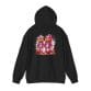 The Halloween Street Pumpkin Men Unisex Heavy Blend™ Hooded Sweatshirt features two pumpkin-headed figures in pink outfits with a paint splatter background on a black hoodie.