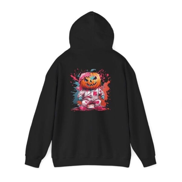 The Halloween Pumpkin Man Unisex Heavy Blend™ Hooded Sweatshirt features a black hoodie with a vibrant back graphic of a cartoon astronaut pumpkin head, surrounded by red and blue paint splashes.
