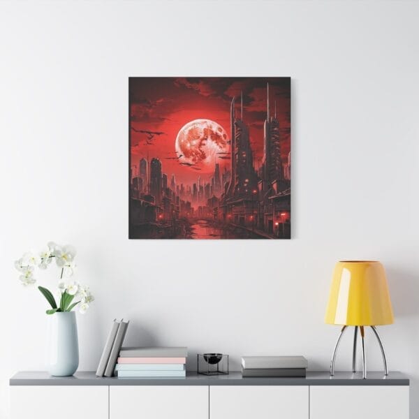 A modern interior with a white console table, decorative objects, and a yellow lamp features the “Blood Moon Over Ruins” dystopian cityscape canvas (1.25" stretched) with a large moon and red tones on the wall. A modern interior with a white console table, decorative objects, and a yellow lamp features the “Blood Moon Over Ruins” dystopian cityscape canvas (1.25" stretched) with a large moon and red tones on the wall.