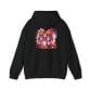 The Halloween Street Pumpkin Men Unisex Heavy Blend™ Hooded Sweatshirt is a black hoodie with two pink-suited, jack-o'-lantern-headed figures side by side on a white splatter background.
